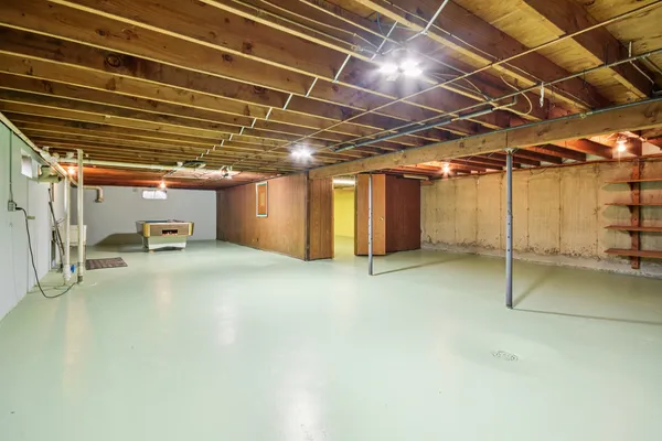 a view of empty room with wooden ceiling
