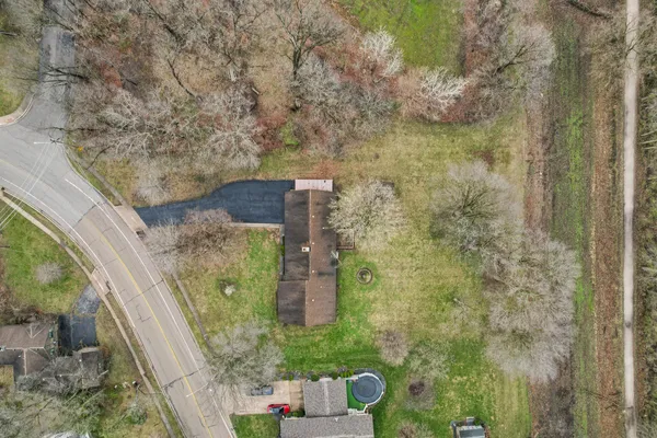 a aerial view of a house with a yard