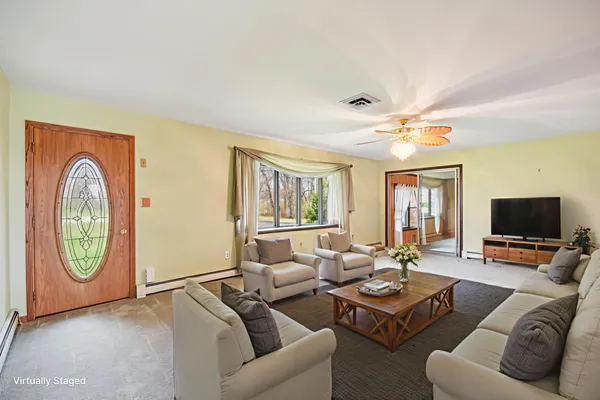 a living room with furniture and a large window