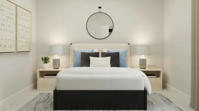 a bedroom with a bed table and a potted plant