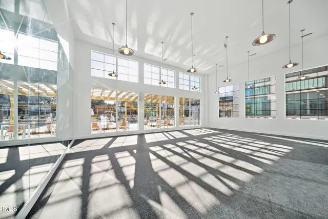 a view of a swimming pool with an outdoor seating