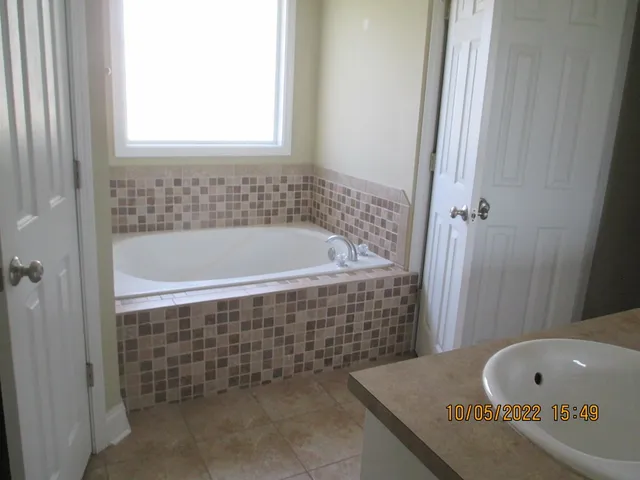 a bathroom with a bath tub and a shower
