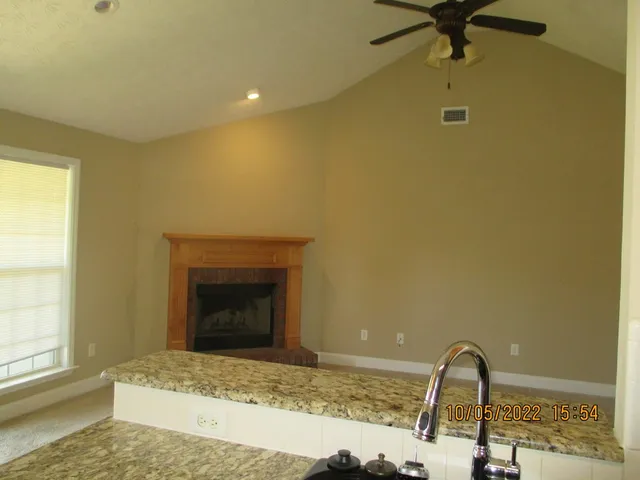 a bedroom with a sink and a window