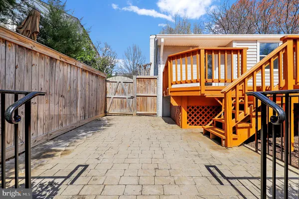 a backyard of a house with wooden stairs