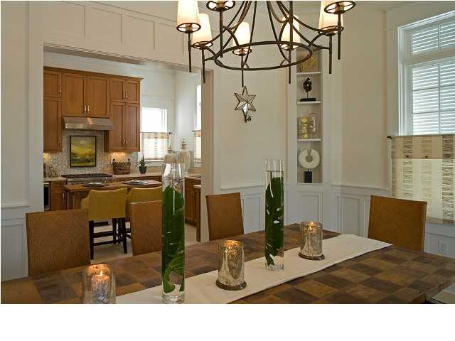 92 Hogpenny Alley Inlet Beach Inlet Beach, FL 32461 - Photo 3 of 12 a kitchen with stainless steel appliances kitchen island granite countertop a table and chairs in it