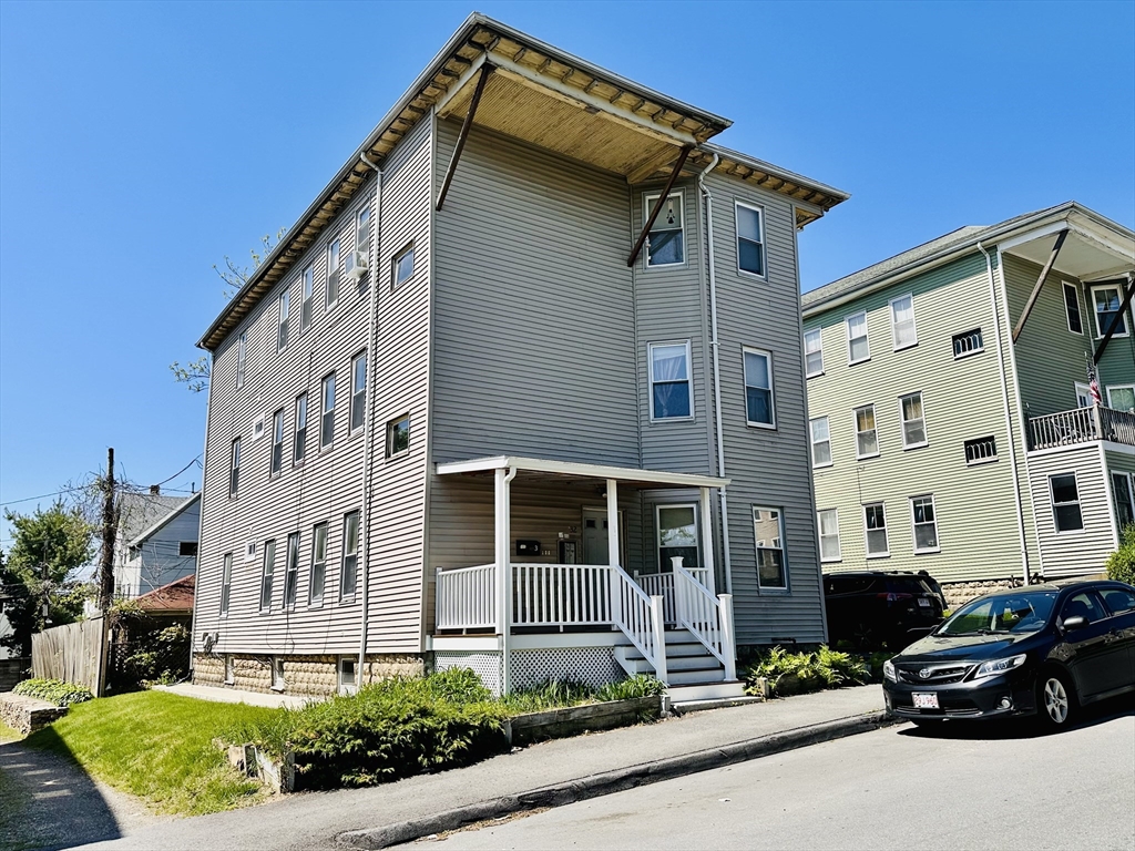 32 Ames Street Worcester, MA 01604 - Photo 1 of 21 a car parked in front of a white building