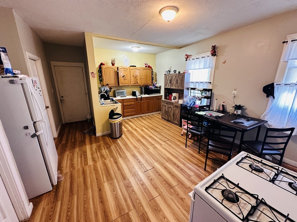 32 Ames Street Worcester, MA 01604 - Photo 12 of 21 a living room with furniture and a wooden floor