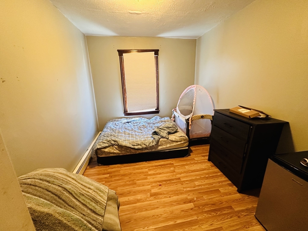 32 Ames Street Worcester, MA 01604 - Photo 7 of 21 a bedroom with a bed and window