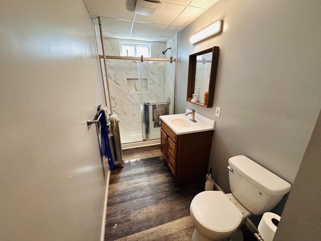 32 Ames Street Worcester, MA 01604 - Photo 8 of 21 a bathroom with a toilet a sink and mirror