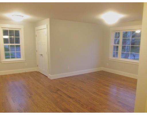 3 Hutchinson Road Lexington, MA 02421 - Photo 23 of 36 an empty room with wooden floor and windows