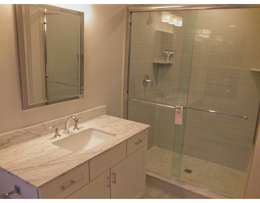 3 Hutchinson Road Lexington, MA 02421 - Photo 25 of 36 a bathroom with a sink shower and a mirror
