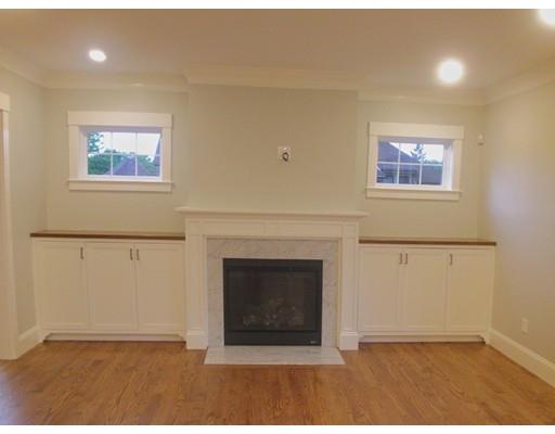 3 Hutchinson Road Lexington, MA 02421 - Photo 6 of 36 a view of an empty room with a fireplace