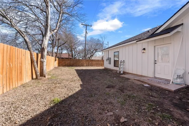 a view of a backyard of the house