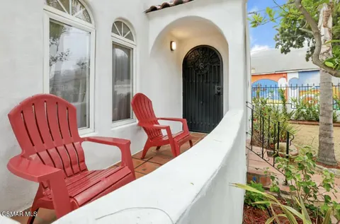 a view of a living room and balcony