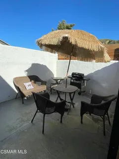 a view of a terrace with sitting area