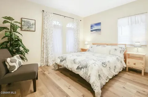 a bedroom with a bed and a couch