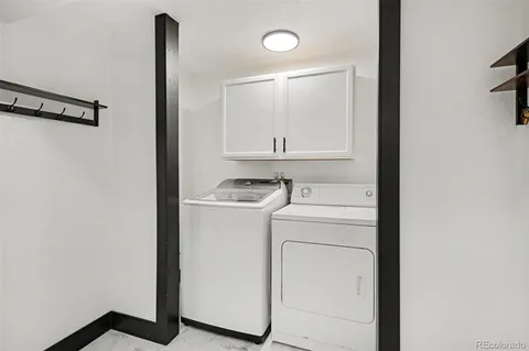 a view of storage and utility room with washer and dryer