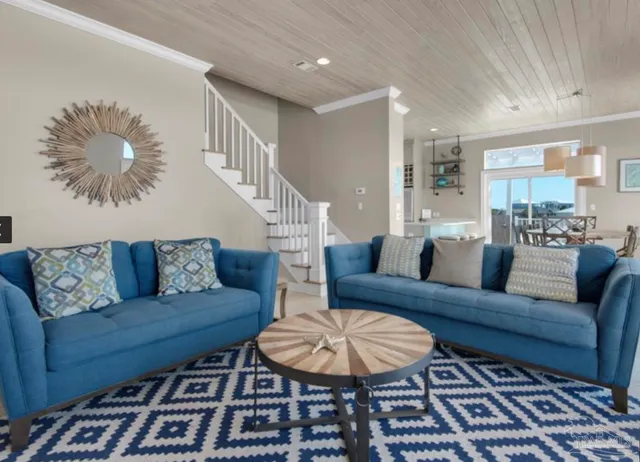 a living room with furniture fireplace and window