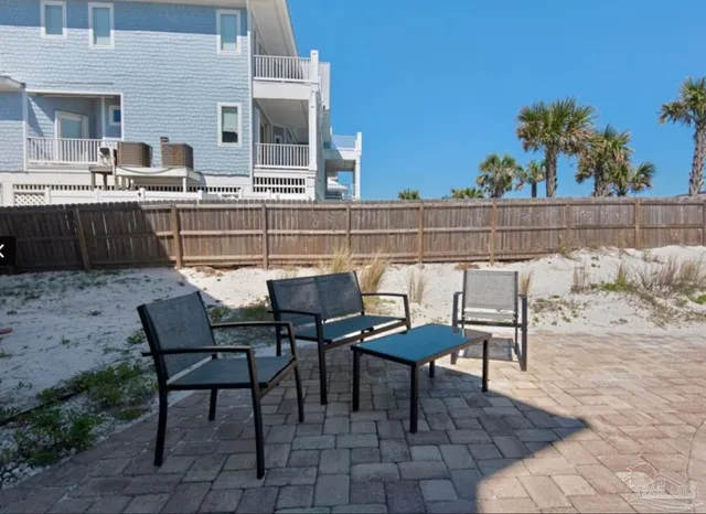 a view of a swimming pool with lounge chairs