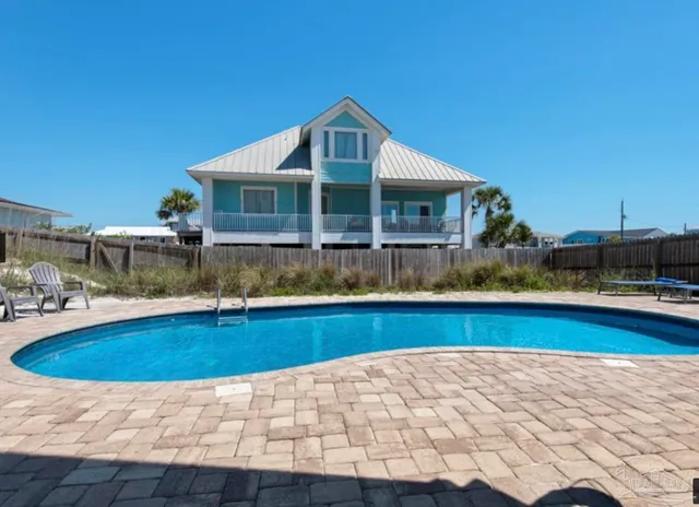 a view of balcony with outdoor seating and wooden floor