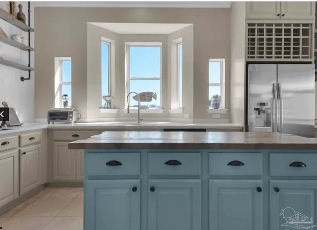 a bathroom with a sink and a window