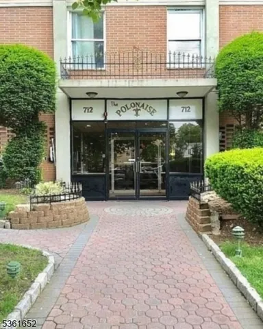 a view of a building with a entrance gate