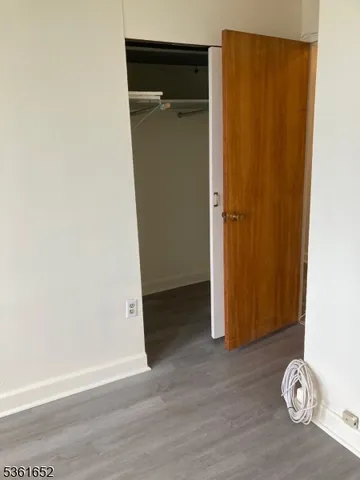 an empty room with wooden floor