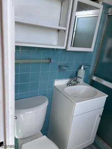 a bathroom with a sink and toilet