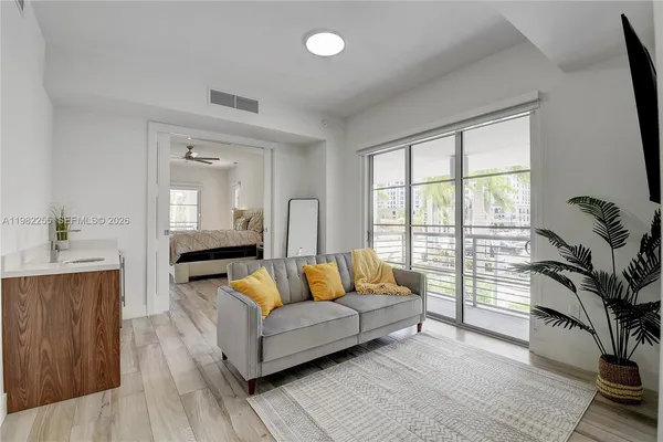 a living room with furniture and a large window