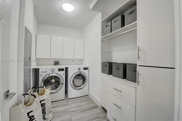 a utility room with dryer and washer
