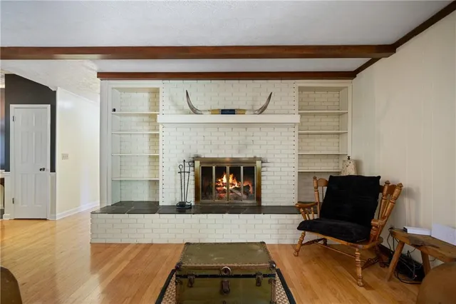 a bathroom with a sink double vanity granite tub shower and a mirror