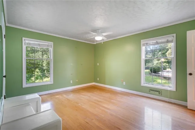a view of a livingroom with furniture and a wooden floor