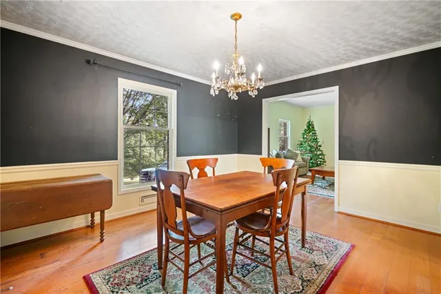 a kitchen with stainless steel appliances granite countertop sink stove top oven and cabinets