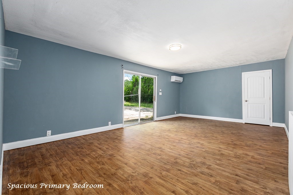 2915 Freeman Street Lufkin, TX 75901 - Photo 17 of 33 a view of an empty room with wooden floor and a window