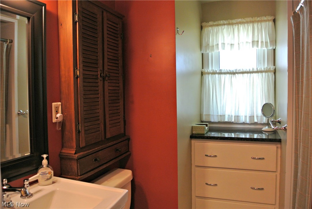13519 Thraves Road Cleveland, OH 44125 - Photo 11 of 30 Bathroom remodeled with pedestal sink and walk-in shower/tub