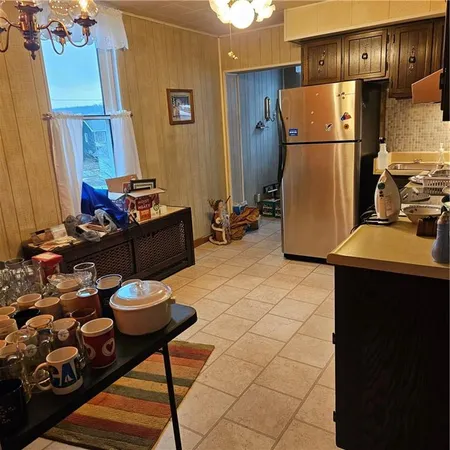 a kitchen with stainless steel appliances a refrigerator and a stove