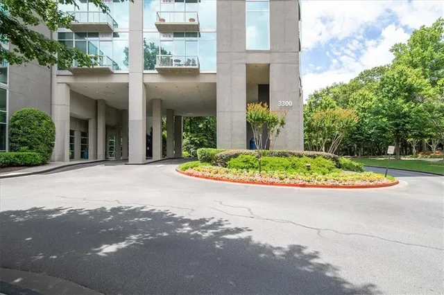 a view of a house with potted plants