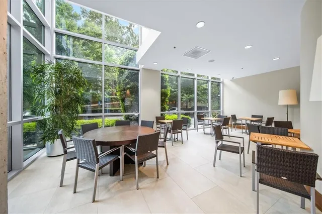 a view of a dining room with furniture window and outside view