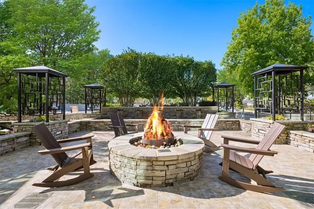 a view of a patio with a table and chairs