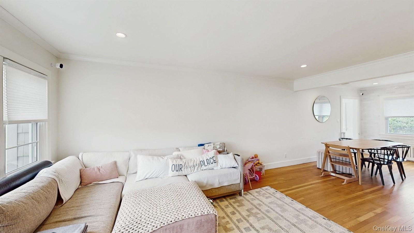 170 Wetherill Road Garden City, NY 11530 - Photo 4 of 23 Living area featuring recessed lighting, light wood-style flooring, baseboards, and crown molding