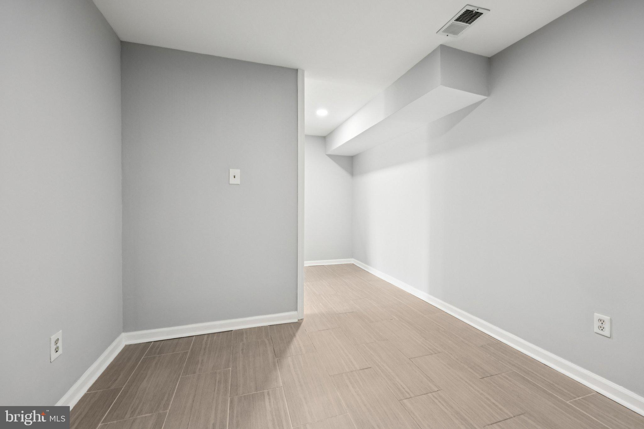 500 Giles Place Sterling, VA 20164 - Photo 16 of 41 a view of an empty room with wooden floor