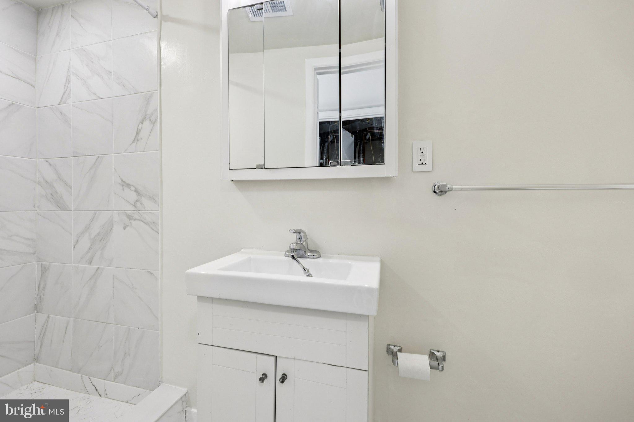 500 Giles Place Sterling, VA 20164 - Photo 17 of 41 a bathroom with a sink and a mirror
