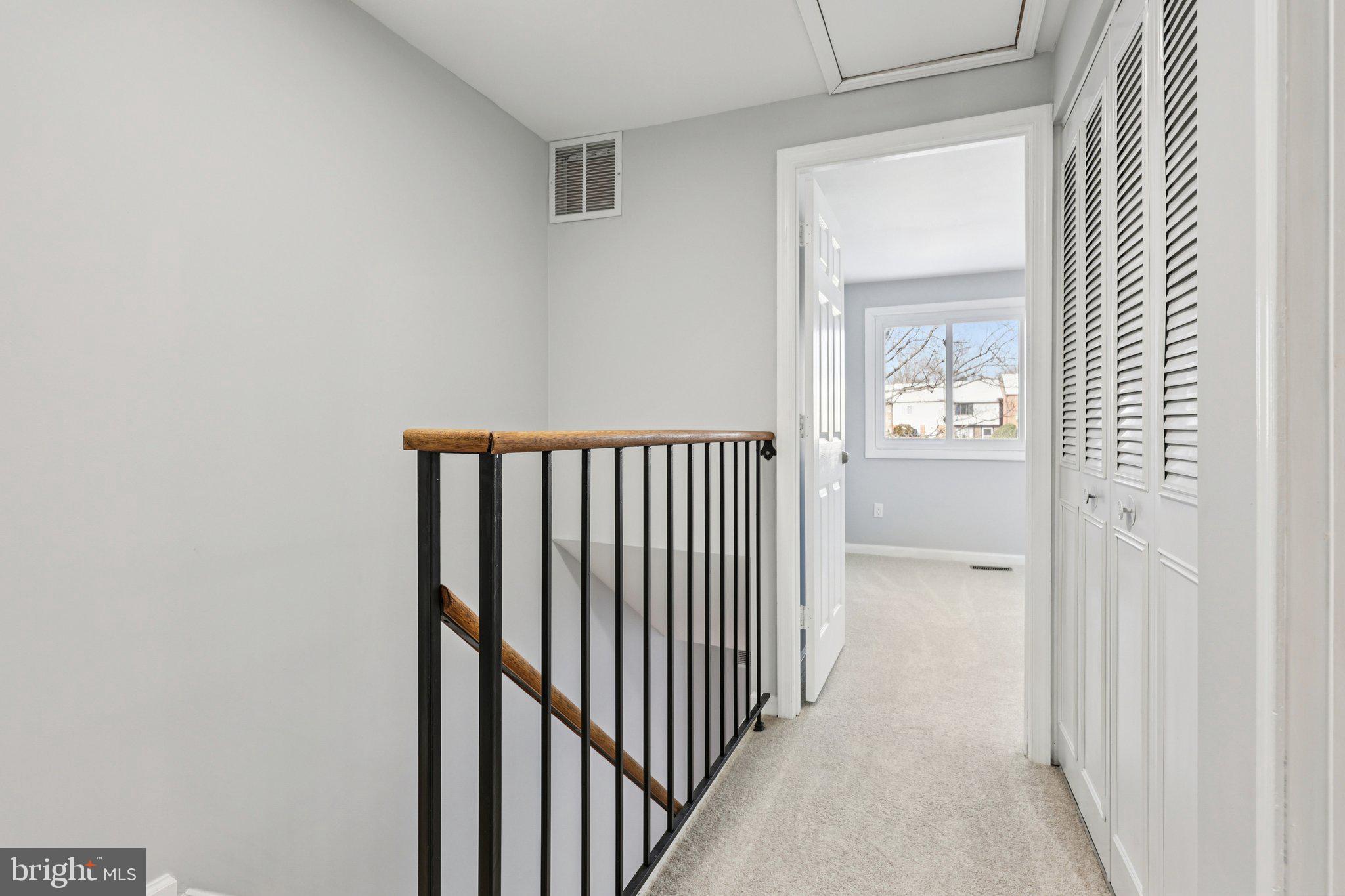 500 Giles Place Sterling, VA 20164 - Photo 19 of 41 a view of a hallway with a door and a window