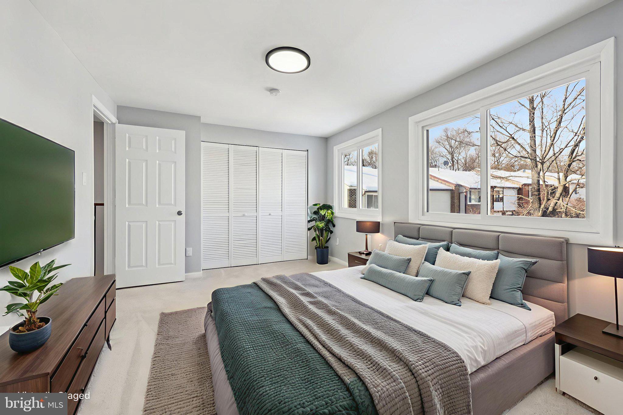 500 Giles Place Sterling, VA 20164 - Photo 25 of 41 a spacious bedroom with a bed and a flat screen tv