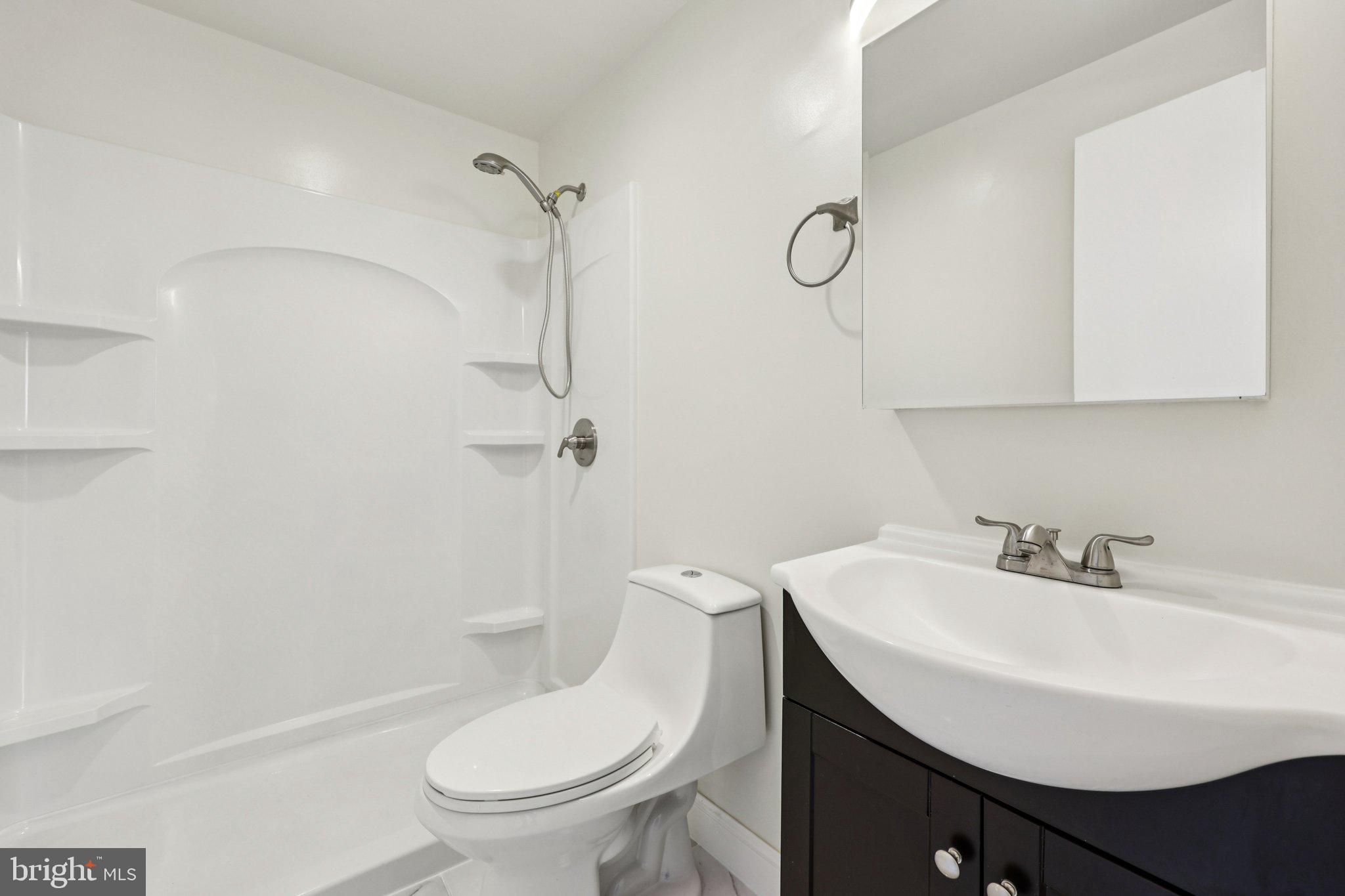 500 Giles Place Sterling, VA 20164 - Photo 26 of 41 a bathroom with a sink toilet and shower
