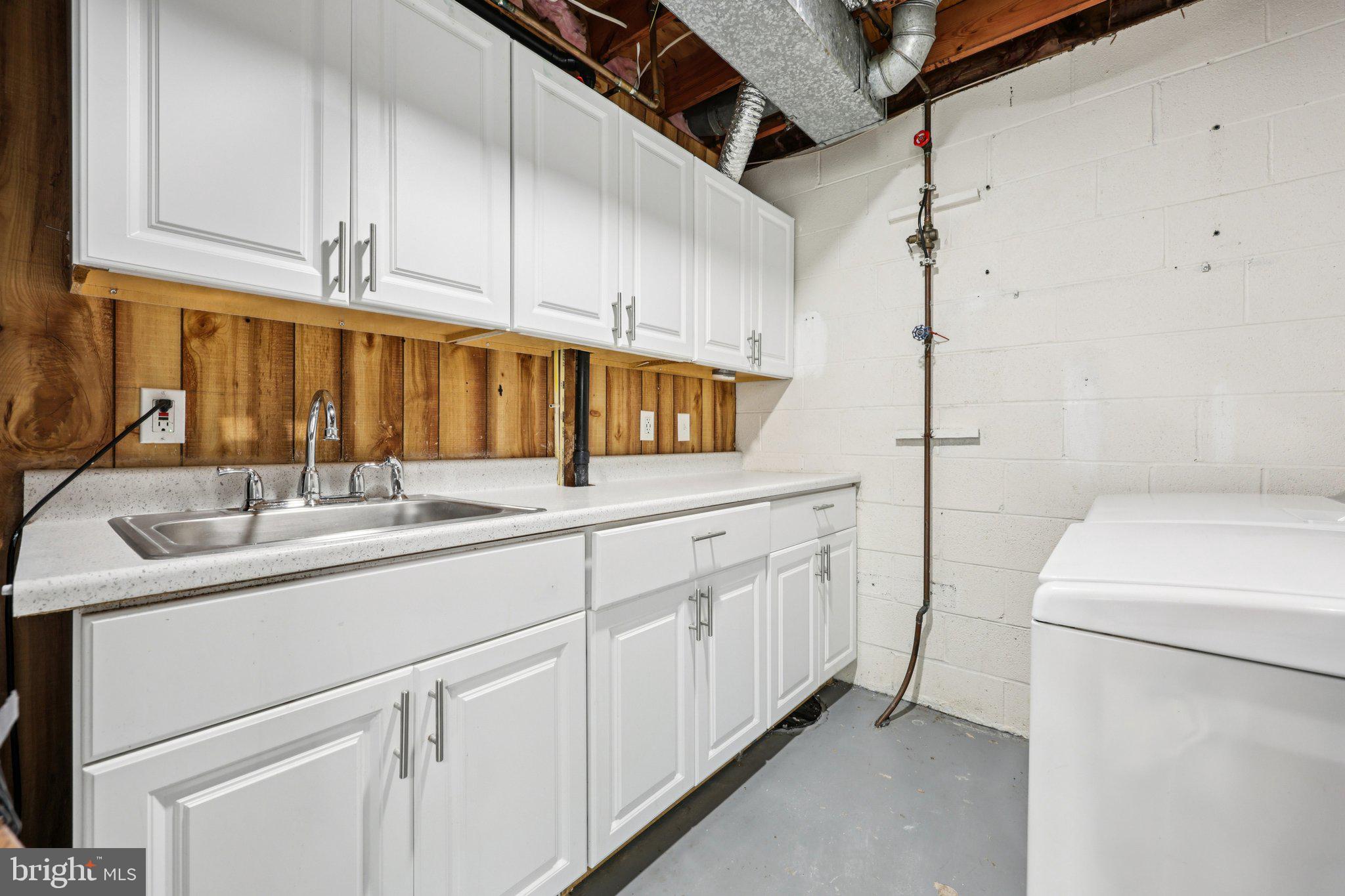 500 Giles Place Sterling, VA 20164 - Photo 40 of 41 a kitchen with a sink and cabinets