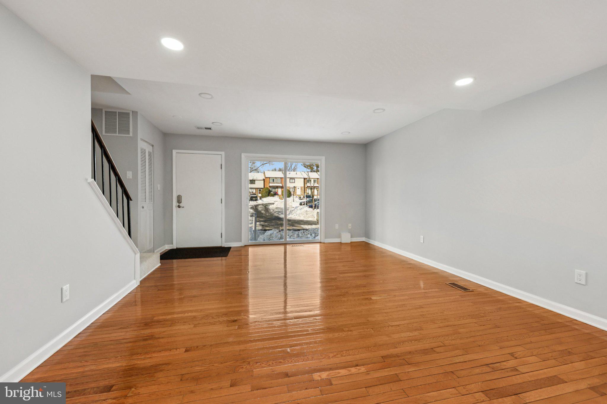 500 Giles Place Sterling, VA 20164 - Photo 4 of 41 wooden floor in an empty room with a window