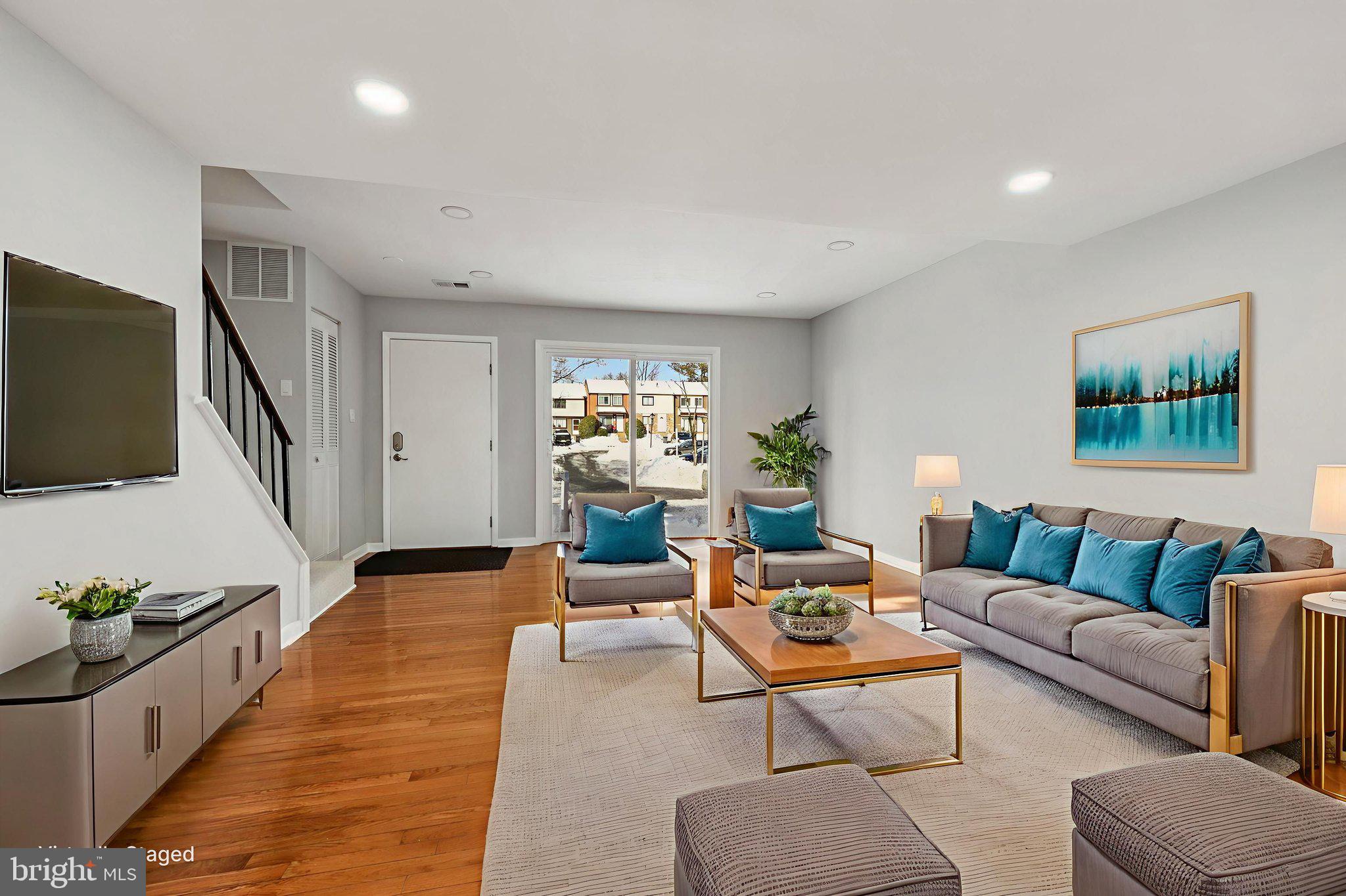 500 Giles Place Sterling, VA 20164 - Photo 5 of 41 a living room with furniture and a flat screen tv
