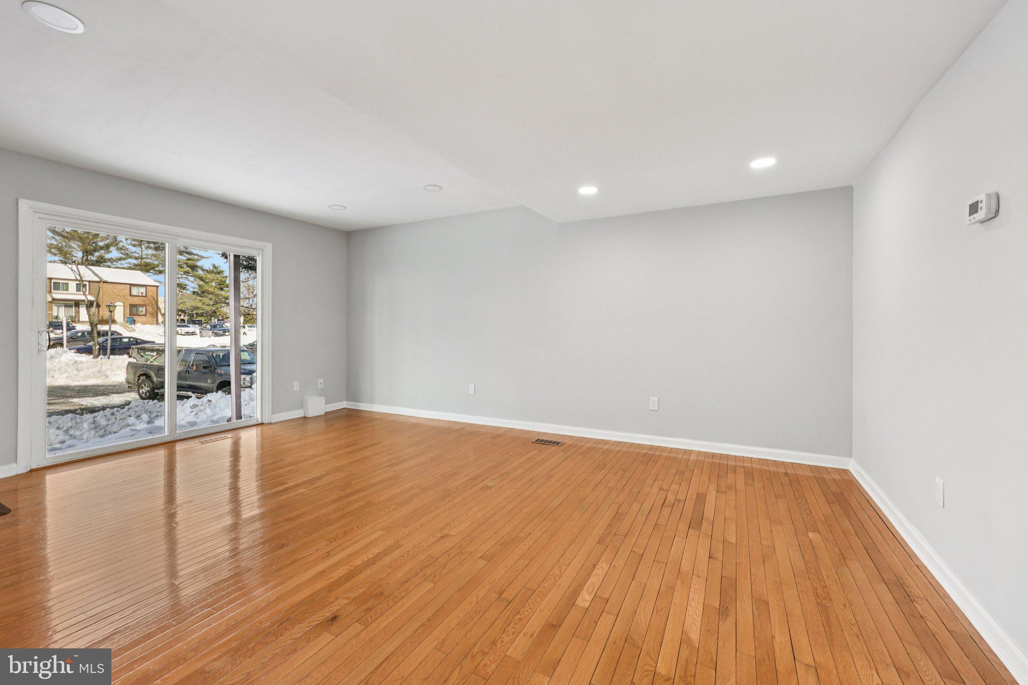 500 Giles Place Sterling, VA 20164 - Photo 8 of 41 a view of empty room with wooden floor and fan