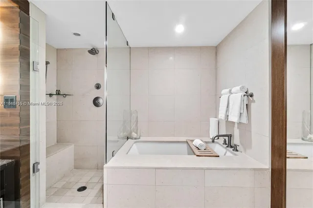 a bathroom with a shower and a sink
